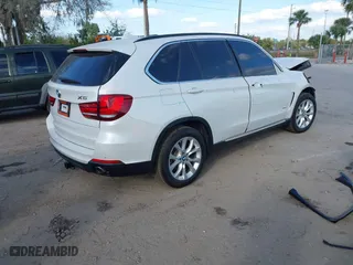 2016 BMW X5 xDrive35i with VIN 5UXKR0C54G0P27141, listed as a IAAI auction lot 41553602 with 61,947 mi miles. Bid and sale history available at carsss.com. Image 4.