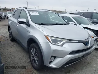 2016 Toyota RAV4 Hybrid XLE with VIN JTMRJREVXGD029019, listed as a IAAI auction lot 42021530 with 74,400 mi miles. Bid and sale history available at carsss.com. Image 1.