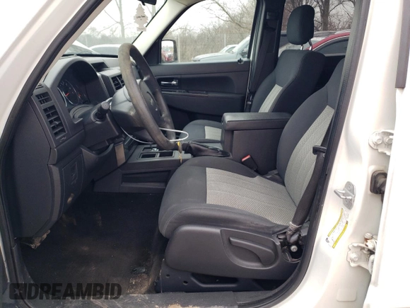 2010 Jeep Liberty Sport with VIN 1J4PP2GK9AW133958, listed as a Copart auction lot 47265675 with 124,466 mi miles and Salvage Title. Bid and sale history available at DreamBid. Image 7.