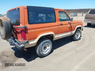 1987 Ford Bronco with VIN 1FMCU14T2HUB19762, listed as a IAAI auction lot 42336288 with 78,488 mi miles and . Bid and sale history available at DreamBid. Image 4.