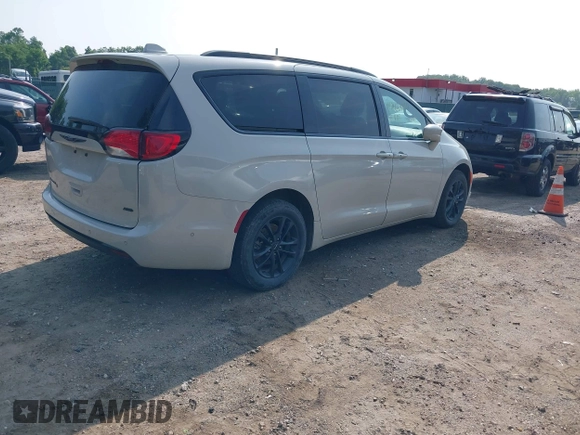 2020 Chrysler Pacifica Launch Edition with VIN 2C4RC3BGXLR267876, listed as a IAAI auction lot 42424841 with 87,586 mi miles and . Bid and sale history available at DreamBid. Image 4.