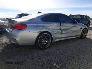 2015 BMW M4 with VIN WBS3R9C58FK334216, listed as a Copart auction lot 61497804 with 112,191 mi miles and Salvage Title. Bid and sale history available at carsss.com. Image 3.