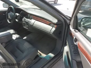 2003 Cadillac DeVille with VIN 1G6KD54Y13U173679, listed as a IAAI auction lot 41686383 with 106,054 mi miles. Bid and sale history available at carsss.com. Image 5.