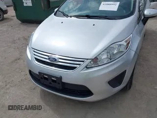 2013 Ford Fiesta SE z VIN 3FADP4BJ3DM207999, wystawiony jako IAAI lot #41880992 z przebiegiem 133 443 mil mil oraz . Historia ofert i sprzedaży dostępna na DreamBid. Obrazek 6.
