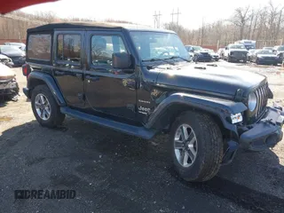 2018 Jeep Wrangler Unlimited Sahara with VIN 1C4HJXEG9JW263178, listed as a IAAI auction lot 41877138 with 82,723 mi miles. Bid and sale history available at carsss.com. Image 1.