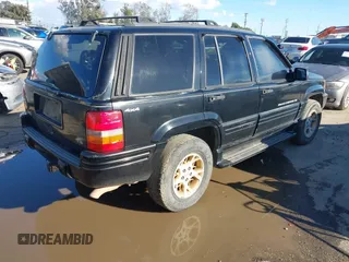1998 Jeep Grand Cherokee Limited z VIN 1J4GZ78Y3WC105625, wystawiony jako IAAI lot #41742805 z przebiegiem 222 045 mil mil oraz . Historia ofert i sprzedaży dostępna na DreamBid. Obrazek 4.