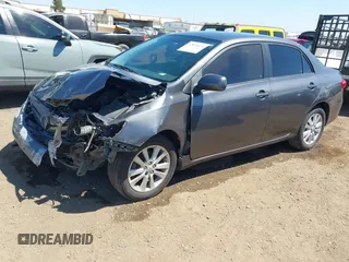 2011 Toyota Corolla L with VIN 2T1BU4EE7BC738640, listed as a IAAI auction lot 42024474 with 164,322 mi miles. Bid and sale history available at carsss.com. Image 2.