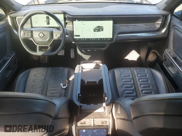 2022 Rivian R1S Launch Edition with VIN 7PDSGABL1NN000514, listed as a Copart auction lot 77444184 with 29,490 mi miles and Salvage Title. Bid and sale history available at DreamBid. Image 8.