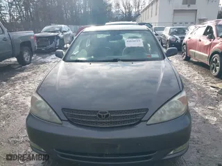 2003 Toyota Camry LE with VIN 4T1BE30K53U649007, listed as a IAAI auction lot 41030219 with 208,469 mi miles. Bid and sale history available at carsss.com. Image 12.