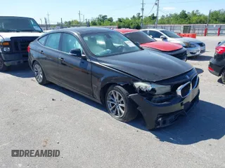 2014 BMW 3 Series GT 328i xDrive with VIN WBA3X5C51ED557347, listed as a IAAI auction lot 42028680 with 178,469 mi miles. Bid and sale history available at carsss.com. Image 1.