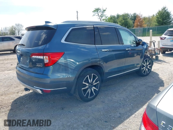 2020 Honda Pilot Touring 8-Passenger with VIN 5FNYF6H93LB034009, listed as a IAAI auction lot 42090993 with 73,325 mi miles and . Bid and sale history available at carsss.com. Image 4.