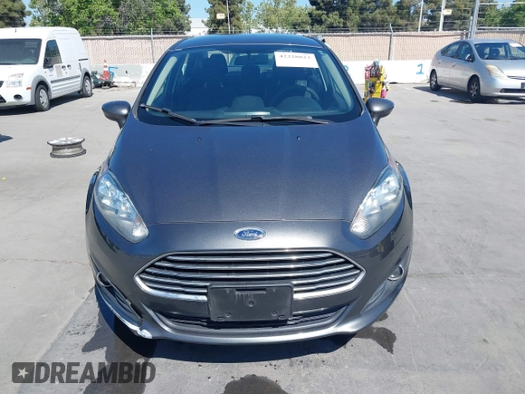 2019 Ford Fiesta SE z VIN 3FADP4BJ2KM131012, wystawiony jako IAAI lot #42228822 z przebiegiem 100 460 mil mil oraz . Historia ofert i sprzedaży dostępna na DreamBid. Obrazek 12.