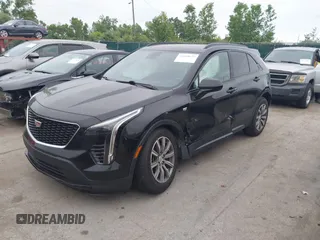 2019 Cadillac XT4 AWD Sport z VIN 1GYFZFR48KF197731, wystawiony jako IAAI lot #42668639 z przebiegiem 73 170 mil mil oraz . Historia ofert i sprzedaży dostępna na DreamBid. Obrazek 2.