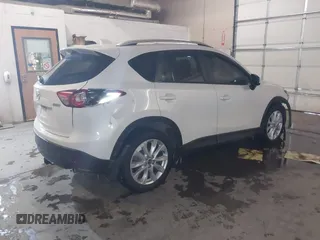 2013 Mazda CX-5 Grand Touring with VIN JM3KE4DE8D0147851, listed as a IAAI auction lot 41570695 with 94,648 mi miles. Bid and sale history available at carsss.com. Image 4.