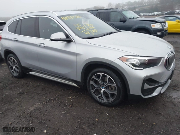 2021 BMW X1 xDrive28i with VIN WBXJG9C04M5T79810, listed as a IAAI auction lot 41471536 with 75,345 mi miles. Bid and sale history available at carsss.com. Image 1.