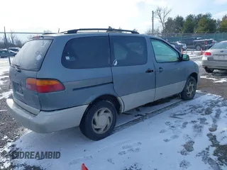 1999 Toyota Sienna LE with VIN 4T3ZF13C2XU118641, listed as a IAAI auction lot 41602097 with 261,792 mi miles. Bid and sale history available at carsss.com. Image 4.