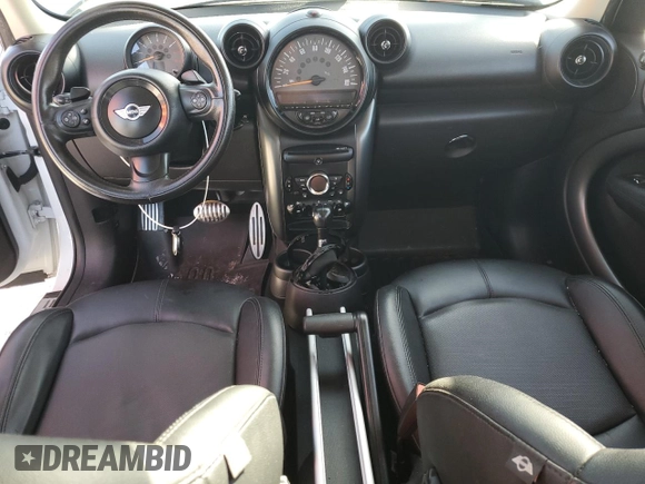 2016 MINI Countryman S with VIN WMWZC5C51GWU01290, listed as a Copart auction lot 77684384 with 106,811 mi miles and Salvage Title. Bid and sale history available at DreamBid. Image 8.