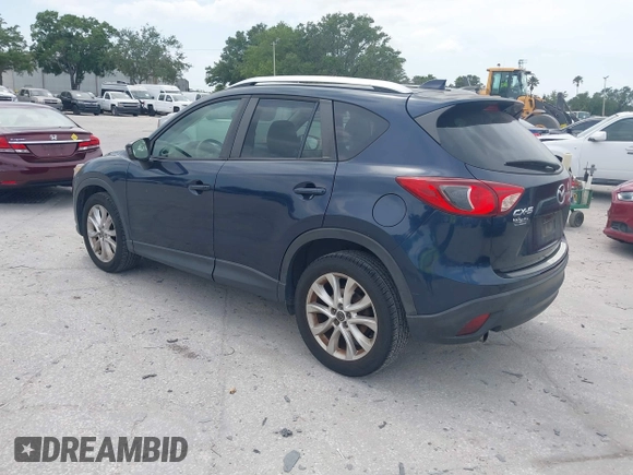 2014 Mazda CX-5 Grand Touring with VIN JM3KE2DY8E0425258, listed as a IAAI auction lot 42179452 with 132,137 mi miles. Bid and sale history available at carsss.com. Image 3.
