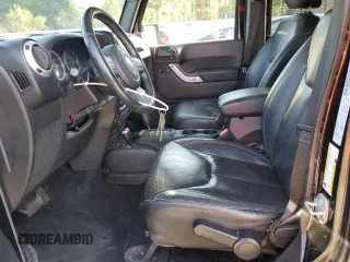 2015 Jeep Wrangler Unlimited Sahara with VIN 1C4HJWEGXFL744852, listed as a Copart auction lot 60246145 with 135,496 mi miles and Salvage title. Bid and sale history available at DreamBid. Image 7.