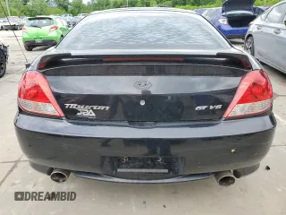 2006 Hyundai Tiburon GT z VIN KMHHN65F66U215304, wystawiony jako Copart lot #56141635 z przebiegiem 149 118 mil mil oraz Szkoda całkowita • Salvage title. Historia ofert i sprzedaży dostępna na DreamBid. Obrazek 6.