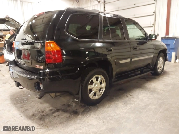 2004 GMC Envoy SLE with VIN 1GKDT13S542265104, listed as a IAAI auction lot 41884797 with 154,190 mi miles. Bid and sale history available at carsss.com. Image 4.