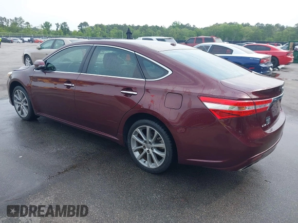 2014 Toyota Avalon Limited with VIN 4T1BK1EB3EU113035, listed as a IAAI auction lot 42040239 with 118,609 mi miles. Bid and sale history available at carsss.com. Image 3.