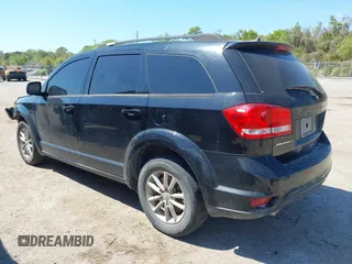 2014 Dodge Journey SXT with VIN 3C4PDCBG5ET250732, listed as a IAAI auction lot 41900940 with 144,301 mi miles. Bid and sale history available at carsss.com. Image 3.