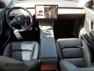 2021 Tesla Model Y Performance with VIN 5YJYGDEF7MF269221, listed as a Copart auction lot 52109785 with 61,619 mi miles and Salvage Title. Bid and sale history available at DreamBid. Image 8.