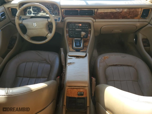 1997 Jaguar XJ with VIN SAJHX1245VC805665, listed as a Copart auction lot 45024125 with 0 mi miles and Salvage Title. Bid and sale history available at carsss.com. Image 8.