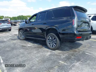 2023 Cadillac Escalade 4WD Sport z VIN 1GYS4EKLXPR513435, wystawiony jako IAAI lot #42137452 z przebiegiem 27 495 mil mil oraz . Historia ofert i sprzedaży dostępna na DreamBid. Obrazek 3.