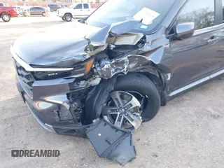2023 Honda Pilot EX-L with VIN 5FNYG1H5XPB044829, listed as a IAAI auction lot 41396208 with 15,277 mi miles and . Bid and sale history available at DreamBid. Image 6.