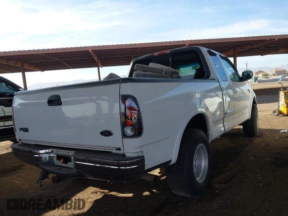 1999 Ford F-150 XL with VIN 2FTRX18L9XCA21004, listed as a IAAI auction lot 41616300 with 186,620 mi miles. Bid and sale history available at carsss.com. Image 4.