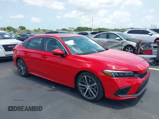 2023 Honda Civic Touring with VIN 2HGFE1F94PH323451, listed as a IAAI auction lot 42383422 with 6,120 mi miles and . Bid and sale history available at DreamBid. Image 1.