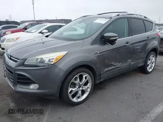 2013 Ford Escape Titanium with VIN 1FMCU0J9XDUD86354, listed as a IAAI auction lot 42420780 with 260,995 mi miles and . Bid and sale history available at DreamBid. Image 2.