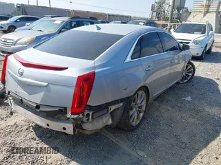 2013 Cadillac XTS Luxury z VIN 2G61R5S38D9228339, wystawiony jako IAAI lot #42664948 z przebiegiem 105 917 mil mil oraz . Historia ofert i sprzedaży dostępna na DreamBid. Obrazek 4.
