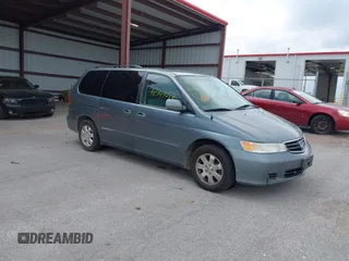 2002 Honda Odyssey EX-L z VIN 5FNRL18082B040131, wystawiony jako IAAI lot #42141487 z przebiegiem 235 003 mil mil oraz . Historia ofert i sprzedaży dostępna na DreamBid. Obrazek 1.