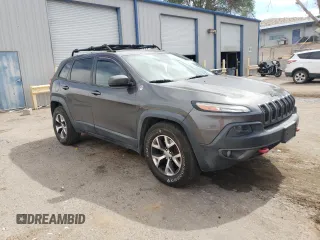 2014 Jeep Cherokee Trailhawk with VIN 1C4PJMBS6EW140981, listed as a Copart auction lot 58260325 with 97,036 mi miles and Salvage title. Bid and sale history available at DreamBid. Image 4.
