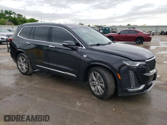 2023 Cadillac XT6 FWD Premium Luxury z VIN 1GYKPCRS5PZ101867, wystawiony jako Copart lot #51773545 z przebiegiem 31 322 mil mil oraz Szkoda całkowita • Salvage title. Historia ofert i sprzedaży dostępna na DreamBid. Obrazek 4.