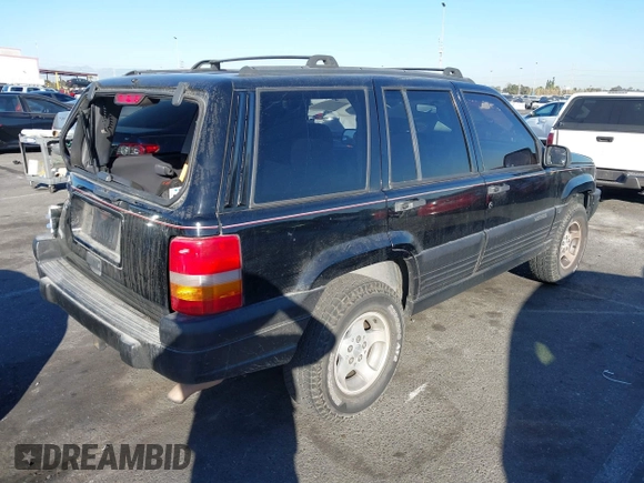 1998 Jeep Grand Cherokee Laredo with VIN 1J4FX58S8WC121904, listed as a IAAI auction lot 41145207 with 222,134 mi miles. Bid and sale history available at carsss.com. Image 4.