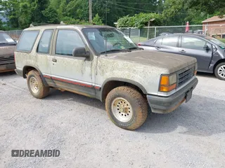 1992 Ford Explorer z VIN 1FMCU24X7NUA67002, wystawiony jako IAAI lot #42420720 z przebiegiem 28 512 mil mil oraz . Historia ofert i sprzedaży dostępna na DreamBid. Obrazek 1.