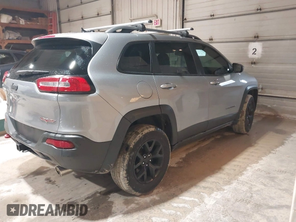 2014 Jeep Cherokee Trailhawk z VIN 1C4PJMBS4EW254963, wystawiony jako IAAI lot #42065845 z przebiegiem 187 356 mil mil oraz . Historia ofert i sprzedaży dostępna na DreamBid. Obrazek 4.