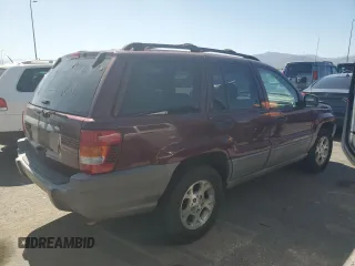 2000 Jeep Grand Cherokee Laredo with VIN 1J4G248S1YC407769, listed as a Copart auction lot 61653545 with 188,882 mi miles and Salvage title. Bid and sale history available at DreamBid. Image 3.
