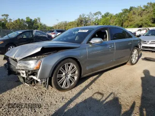 2012 Audi A8 z VIN WAURVAFD2CN016861, wystawiony jako Copart lot #52667165 z przebiegiem 101 793 mil mil oraz Szkoda całkowita • Salvage title. Historia ofert i sprzedaży dostępna na DreamBid. Obrazek 1.