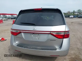 2012 Honda Odyssey Touring with VIN 5FNRL5H92CB055473, listed as a IAAI auction lot 42128601 with 163,901 mi miles. Bid and sale history available at carsss.com. Image 16.