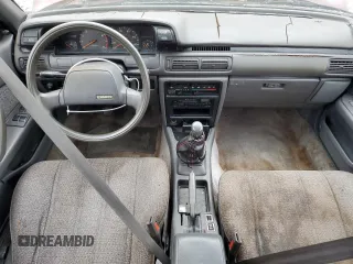 1989 Toyota Camry DLX z VIN 4T1SV21E1KU108151, wystawiony jako Copart lot #73657634 z przebiegiem 347 186 mil mil oraz Nie do naprawy • Non repairable. Historia ofert i sprzedaży dostępna na DreamBid. Obrazek 8.