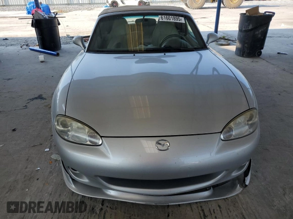 2004 Mazda MX-5 Miata LS z VIN JM1NB353X40404238, wystawiony jako Copart lot #61601895 z przebiegiem 110 549 mil mil oraz Szkoda całkowita • Salvage title. Historia ofert i sprzedaży dostępna na DreamBid. Obrazek 5.