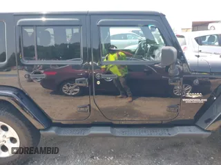 2014 Jeep Wrangler Unlimited Sahara with VIN 1C4BJWEG0EL273086, listed as a IAAI auction lot 42340938 with 121,448 mi miles and . Bid and sale history available at DreamBid. Image 13.