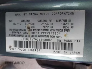 2012 Mazda Mazda3 i Touring with VIN JM1BL1V79C1618007, listed as a IAAI auction lot 41911962 with 192,041 mi miles. Bid and sale history available at carsss.com. Image 9.