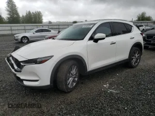2019 Mazda CX-5 Grand Touring with VIN JM3KFBDM4K0669589, listed as a Copart auction lot 54948455 with 64,475 mi miles and Salvage Title. Bid and sale history available at carsss.com. Image 1.