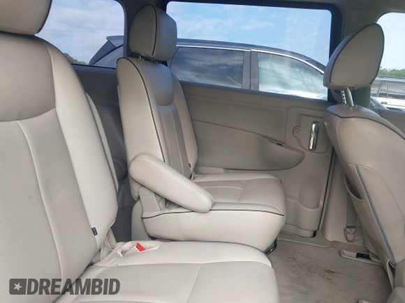 2015 Nissan Quest SV with VIN JN8AE2KP2F9127935, listed as a IAAI auction lot 42139603 with 150,041 mi miles. Bid and sale history available at carsss.com. Image 8.